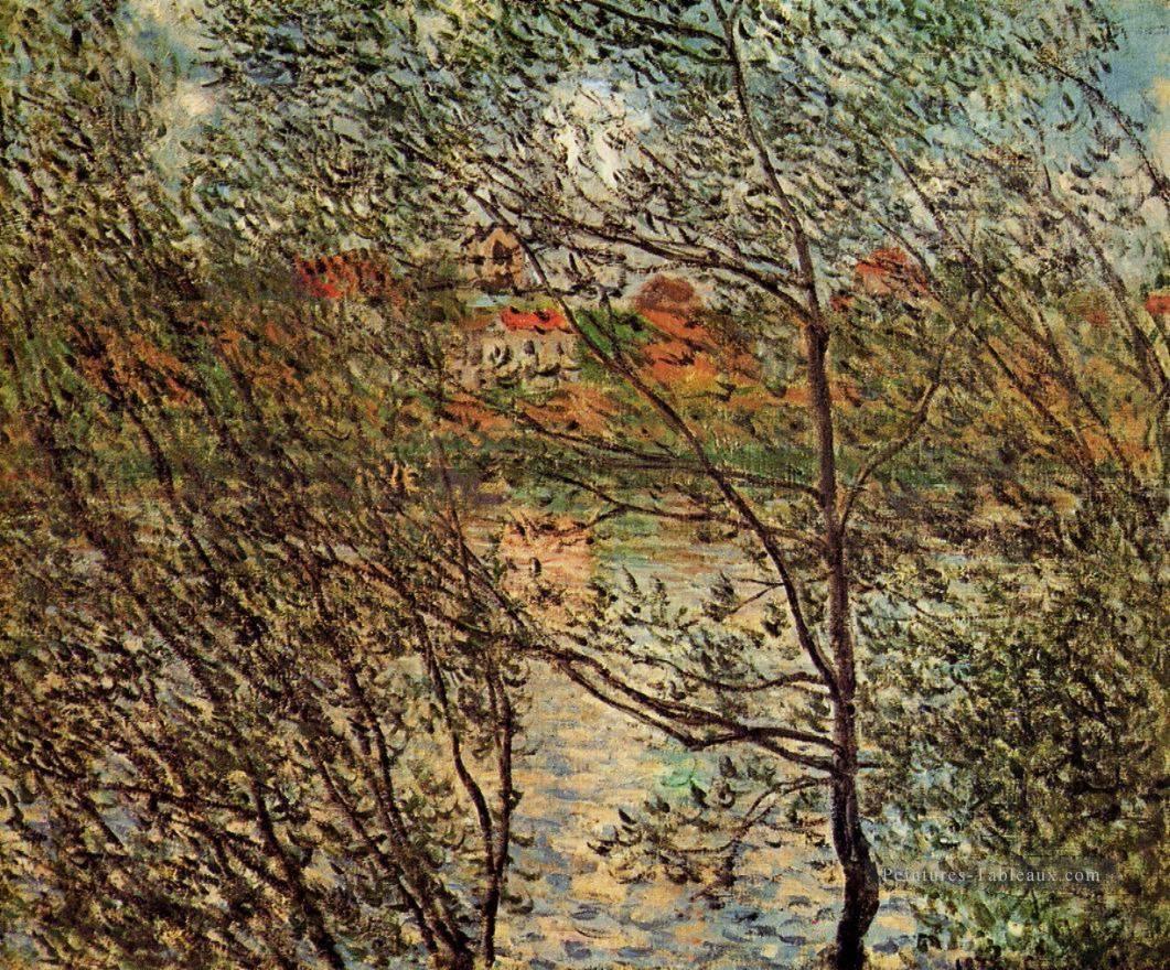 Printemps à travers les Branches Claude Monet Peintures à l'huile